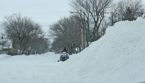 A snowmobiler negotiates the streets of Crosby, North Dakota. Photograph courtesy of the Crosby Journal.